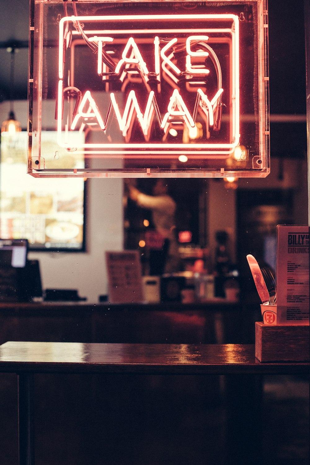 A takeaway bag handed across a counter